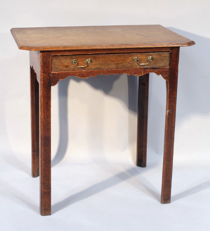 Appraisal: An oak side table the carved top with canted front