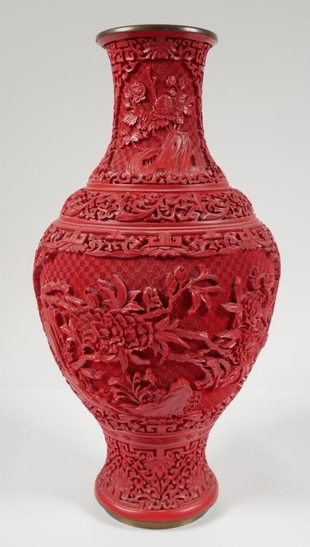 Appraisal: Chinese carved red faux cinnabar lacquer vase Vase measures approx