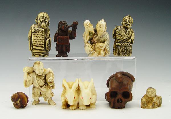 Appraisal: COLLECTION OF IVORY ROSEWOOD NETSUKES To include ivory rabbits with