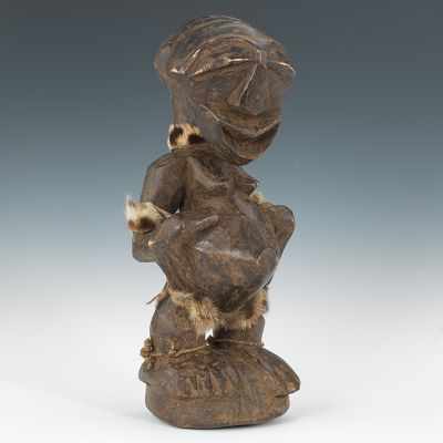 Appraisal: A Songe Female Power Figure Congo Broad feet supported by