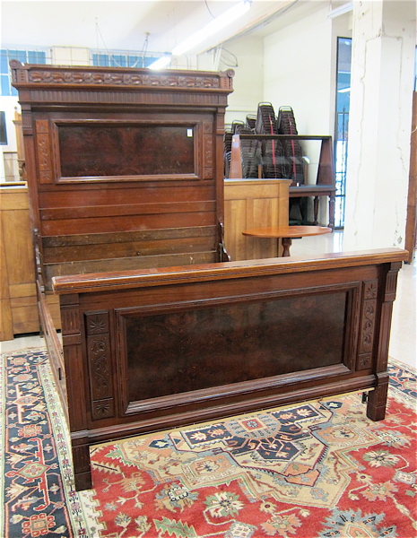 Appraisal: VICTORIAN CARVED WALNUT BED WITH RAILS Eastlake design American c