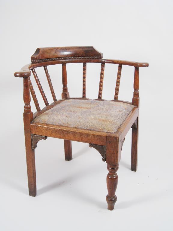 Appraisal: A th Century oak Corner Chair the bowed back above