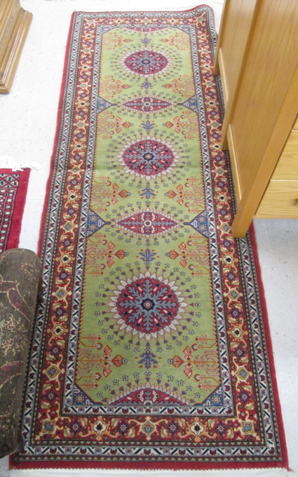 Appraisal: HAND KNOTTED PERSIAN RUNNER a five medallion design on light