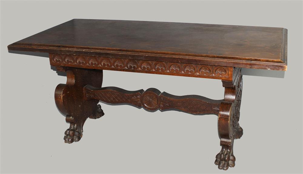 Appraisal: RENAISSANCE REVIVAL CARVED OAK TRESTLE TABLE the rectangular molded top