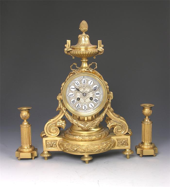 Appraisal: A French gilt brass clock garniture