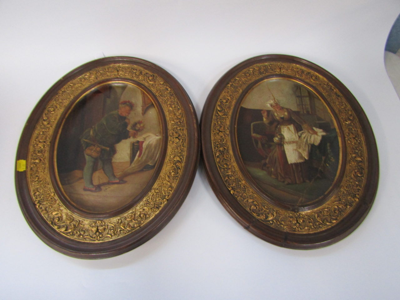 Appraisal: A pair of Goldscheider oval pottery picture plaques painted centrally