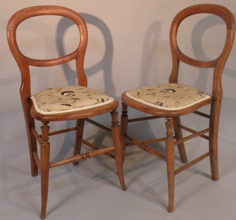 Appraisal: A pair of Victorian mahogany balloonback salon chairs each with