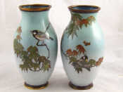 Appraisal: A pair of Japanese cloisonne enamelled vases with a bird