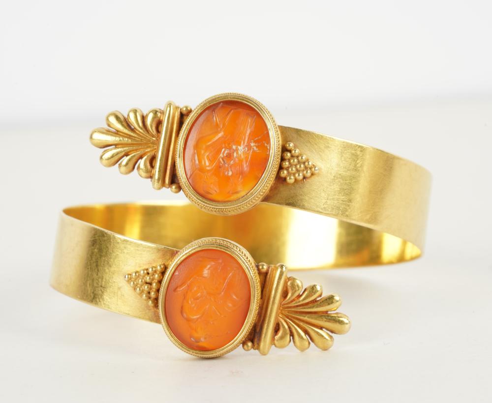 Appraisal: KARAT YELLOW GOLD CARNELIAN BANGLEcontaining two oval tablet cut carnelian