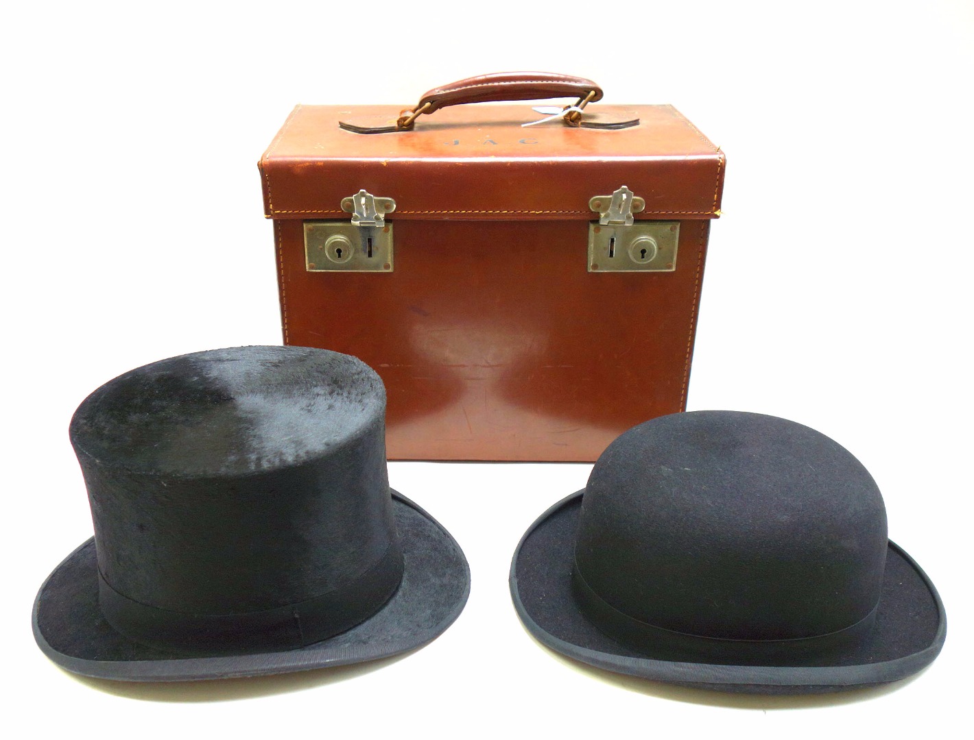 Appraisal: A brushed silk top hat by Woodrow Hunter Co in