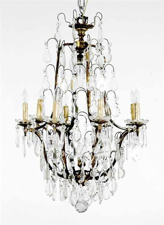 Appraisal: English bronze and crystal eight-light chandelier early th century scrolling