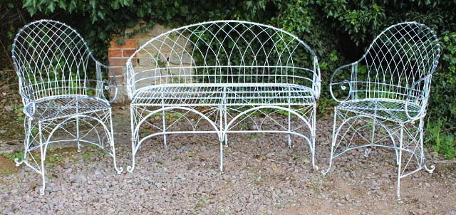 Appraisal: A WHITE PAINTED WIREWORK TWO SEATER BENCH together with a