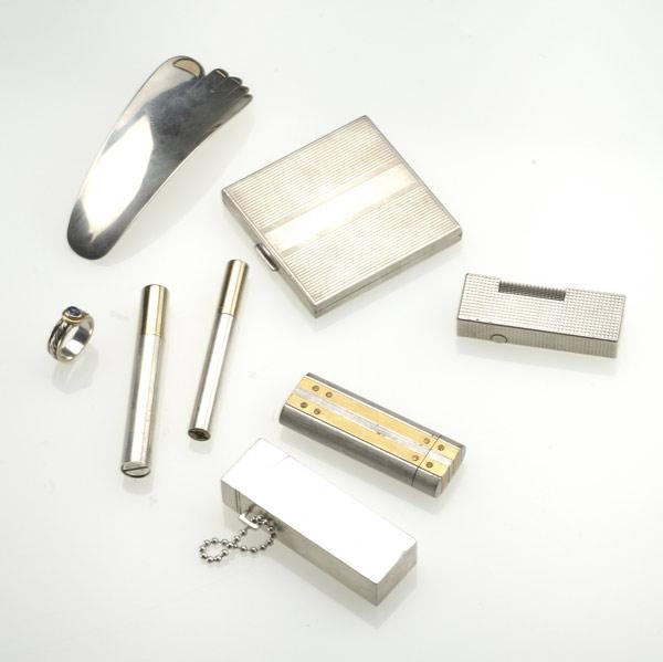 Appraisal: SMOKING ACCESSORIES ETC Eight pieces include Cartier lighter Gucci sterl