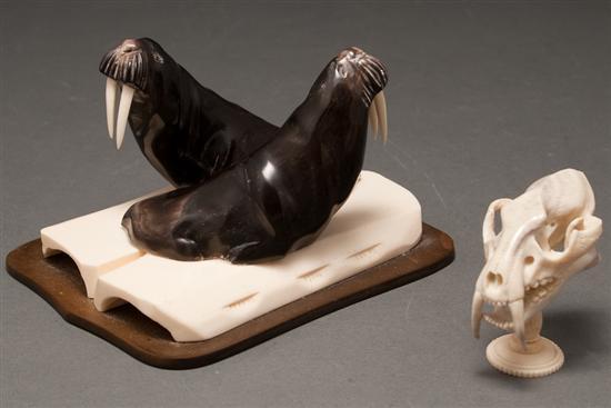 Appraisal: Carved ivory and onyx walrus group and a miniature carved