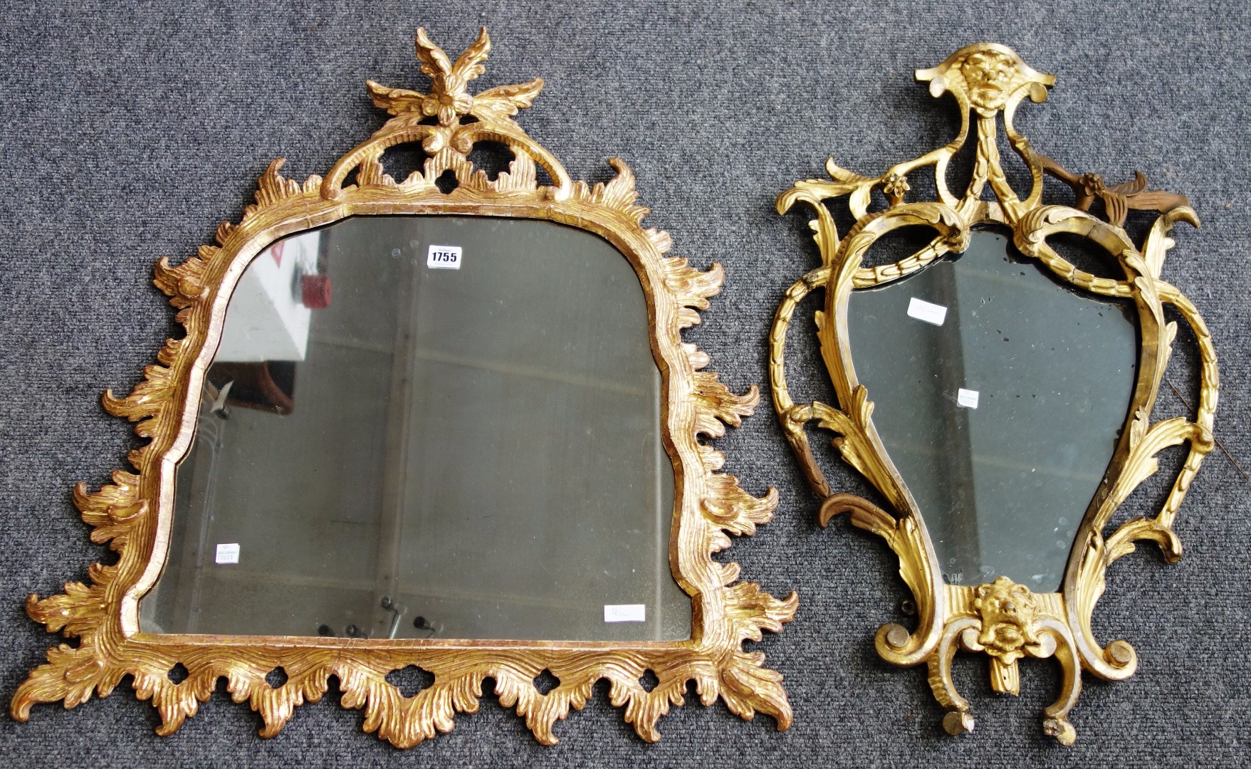 Appraisal: A George III gilt framed wall mirror with floral crest