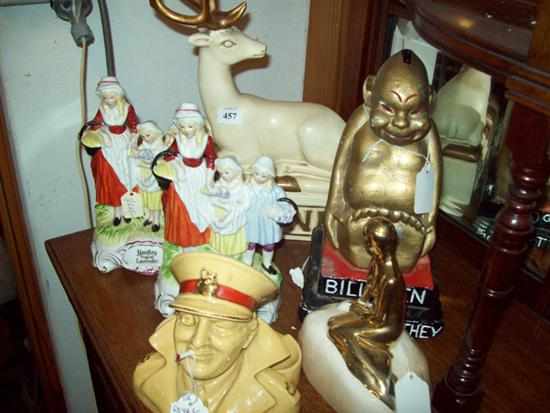 Appraisal: A COGNAC STATUE AND A BILLIKEN STATUE WITH A PAIR