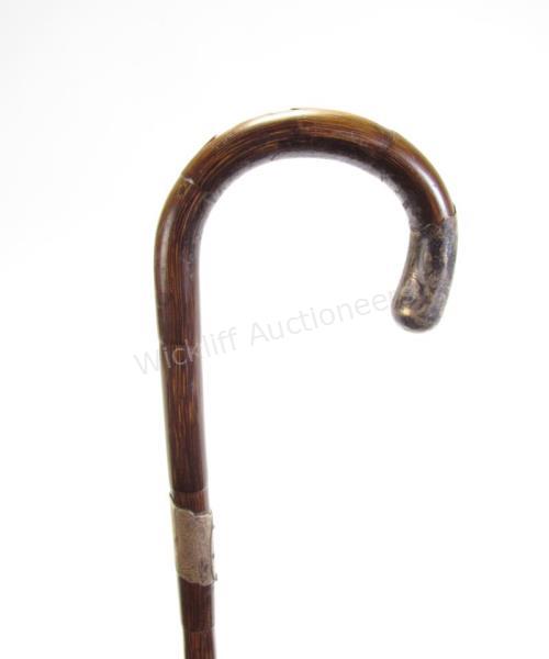 Appraisal: Crook Handled Rattan Sword Cane accented with silver tip and