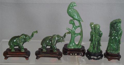 Appraisal: carved green jade elephants w carved green jade wise men