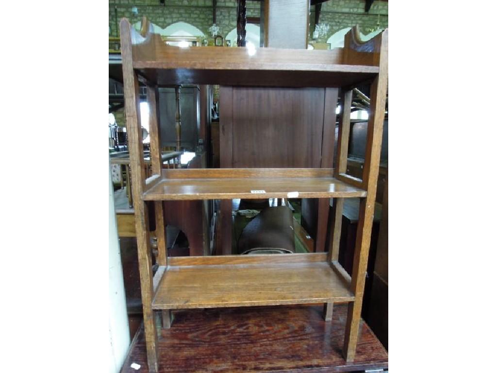 Appraisal: A small Edwardian oak three tier open bookcase together with