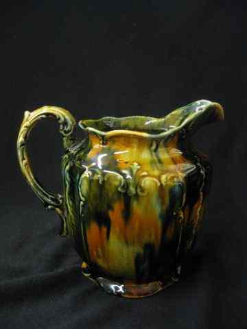 Appraisal: Majolica Pottery Pitcher slip glaze '' base chip