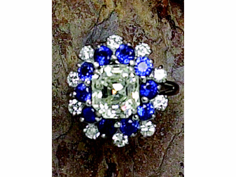 Appraisal: DIAMOND AND SAPPHIRE RING Platinum ballerina style ring centering one