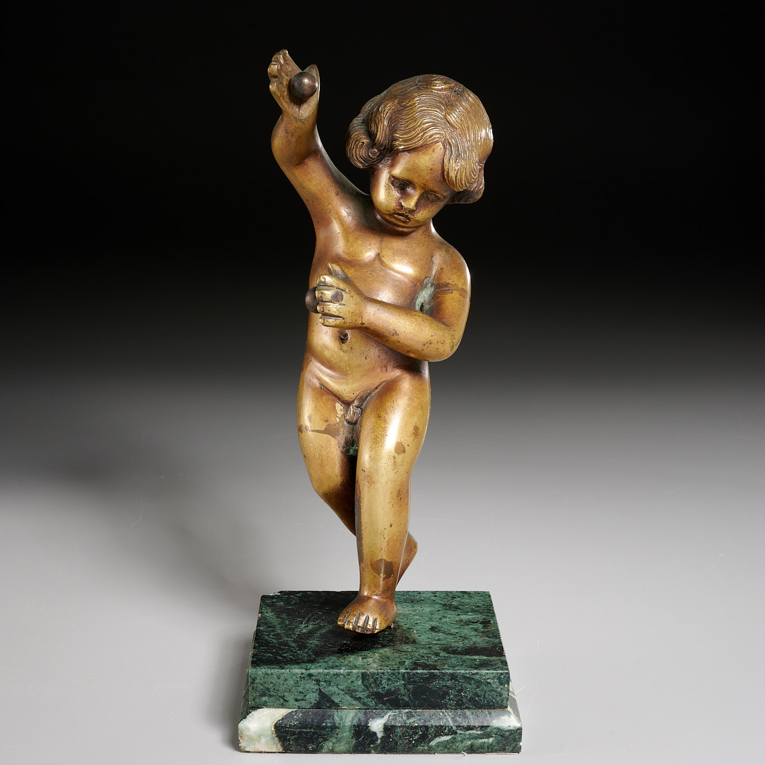 Appraisal: CONTINENTAL BRONZE PUTTO TH C Cast bronze putto on marble