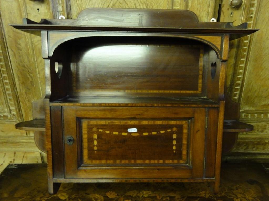 Appraisal: An Edwardian mahogany wall cupboard with satinwood inlay and cross