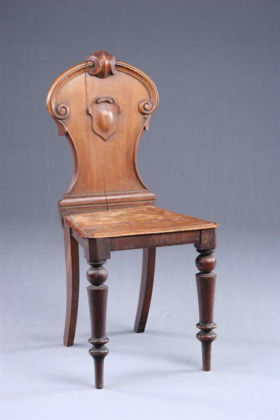 Appraisal: ENGLISH VICTORIAN MAHOGANY HALL CHAIR th century Well-carved cartouche-form back