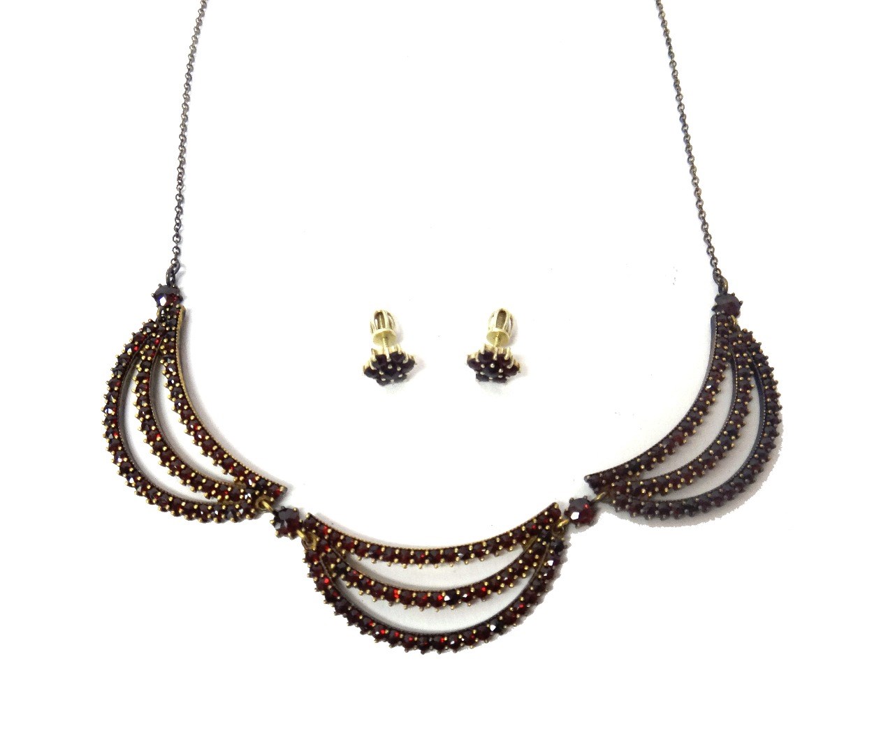 Appraisal: A Bohemian garnet set necklace in a triple three row