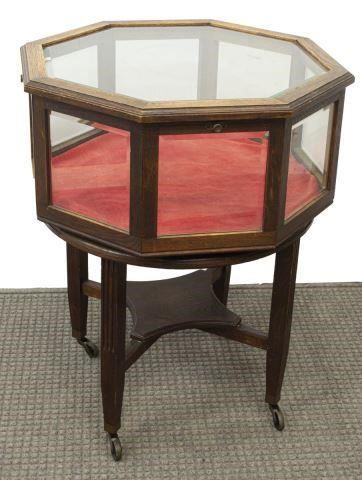 Appraisal: American oak vitrine table early th c glazed octagonal case