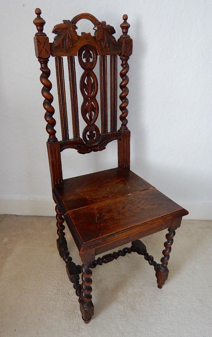 Appraisal: A carved oak single chair with foliate decoration and spiral