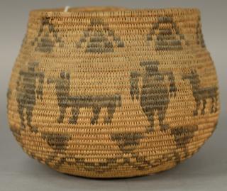 Appraisal: Coiled Indian basket with dog and man figures decoration ht