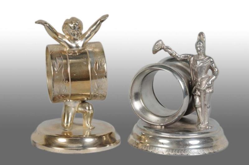 Appraisal: Lot of Figural Napkin Rings Description Includes kneeling baby with