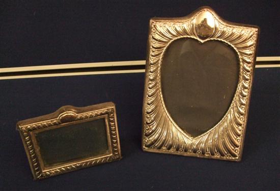 Appraisal: Two modern silver photograph frames one with heart shaped aperture