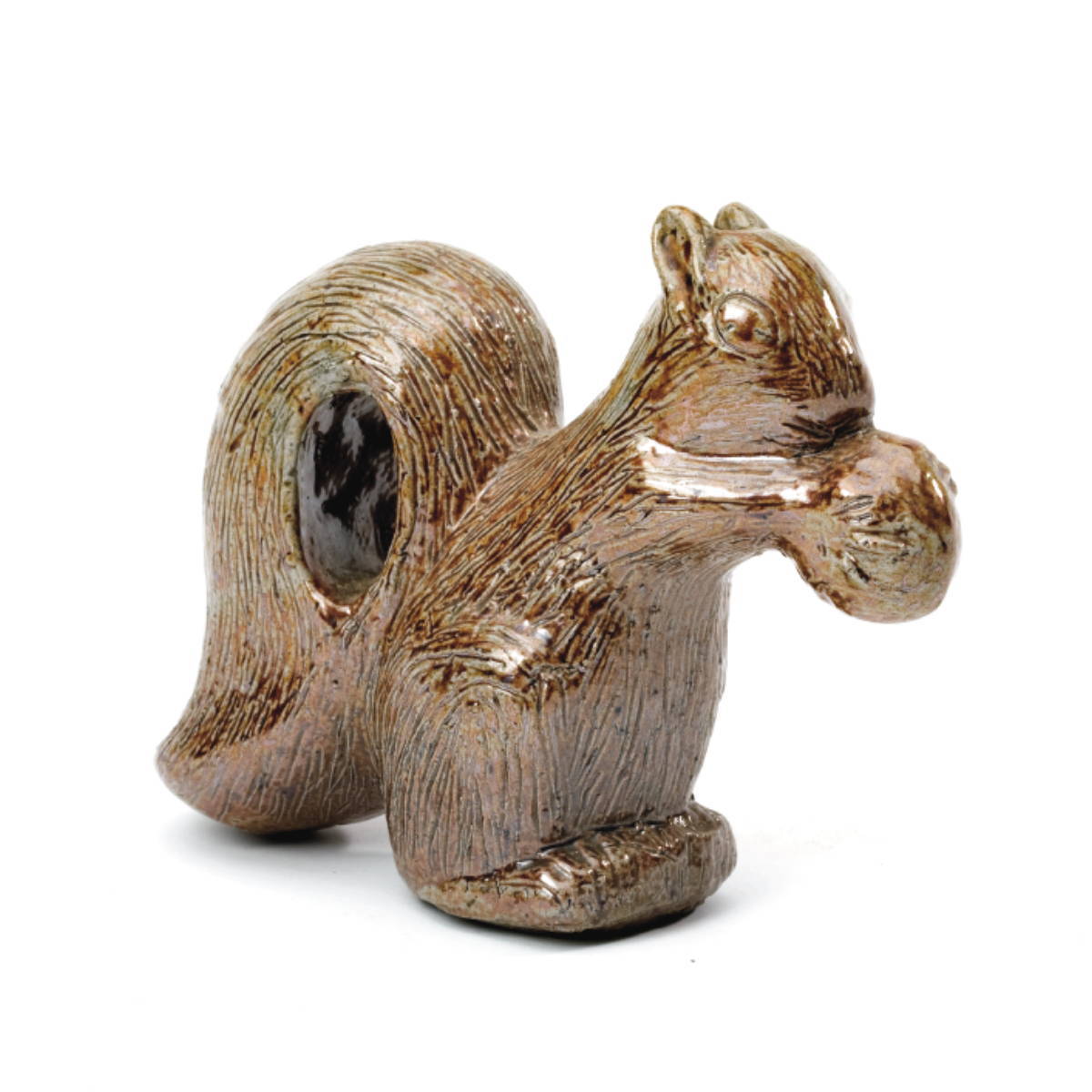 Appraisal: GLAZED EARTHENWARE FIGURE OF A SQUIRREL EATING A NUT Incised