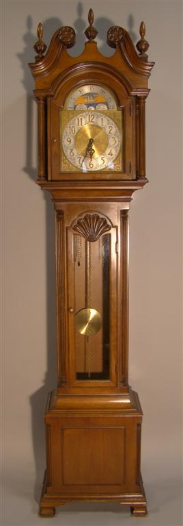 Appraisal: COLONIAL MANUFACTURING CO TALL CASE CLOCK the broken cornice with