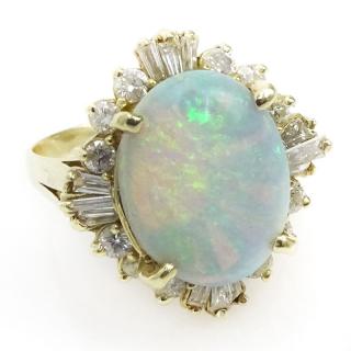 Appraisal: Carat Oval Cabochon Cut Opal Carat Baguette and Round Cut