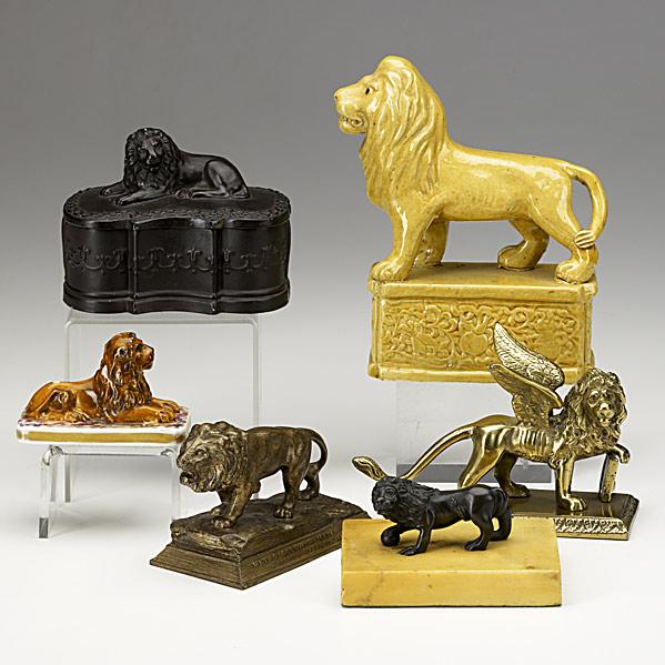 Appraisal: SIX LION FIGURESMGM paperweight terra cotta box yelloware figure crossed