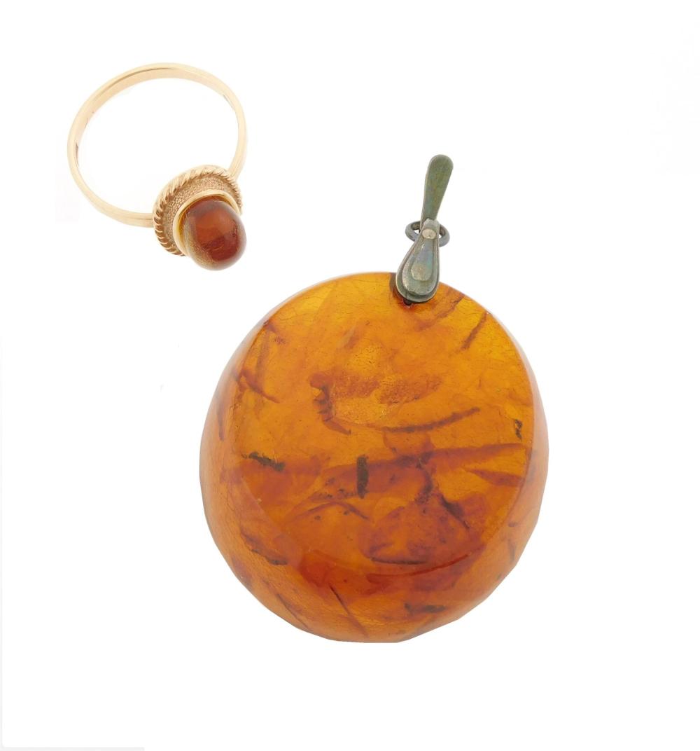 Appraisal: JEWELRY Two pieces of Amber jewelry one large round amber