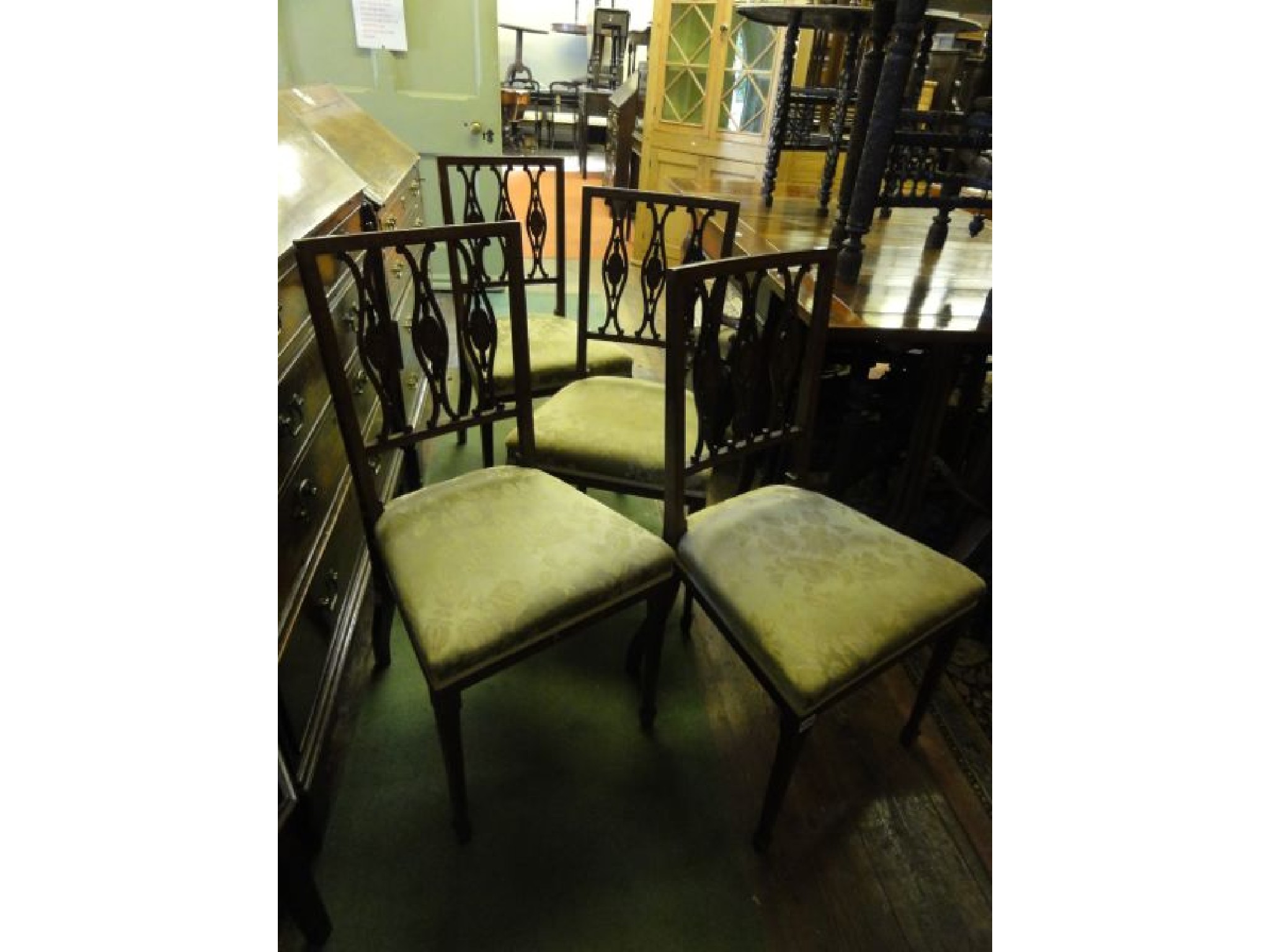 Appraisal: A set of four Edwardian mahogany dining room chairs each