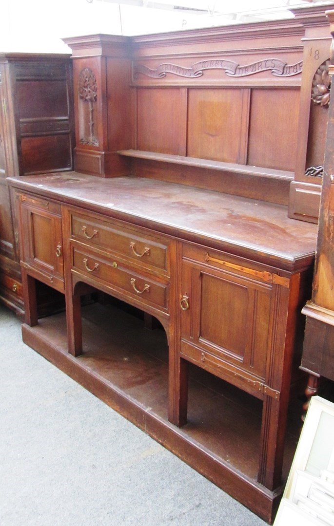 Appraisal: A late th century carved oak Arts and Crafts sideboard