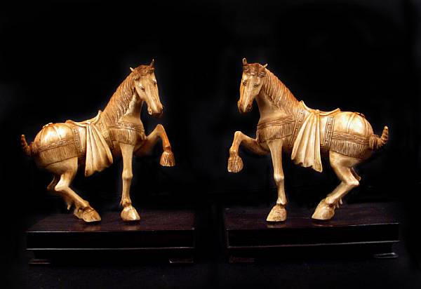 Appraisal: A pair of Chinese carved ivory horses height in width