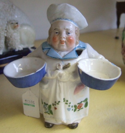 Appraisal: A Nymphenburg pottery salt th century modelled as a baker