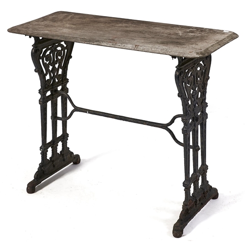 Appraisal: A Victorian conservatory table with cast iron ends united by