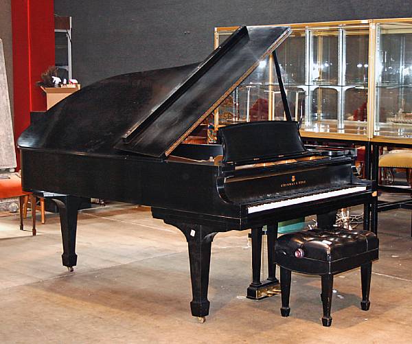 Appraisal: A Steinway ebonized grand piano with bench length ft