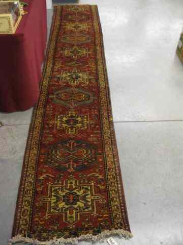 Appraisal: Heriz Persian Handmade Runner interesting medallions on red field '