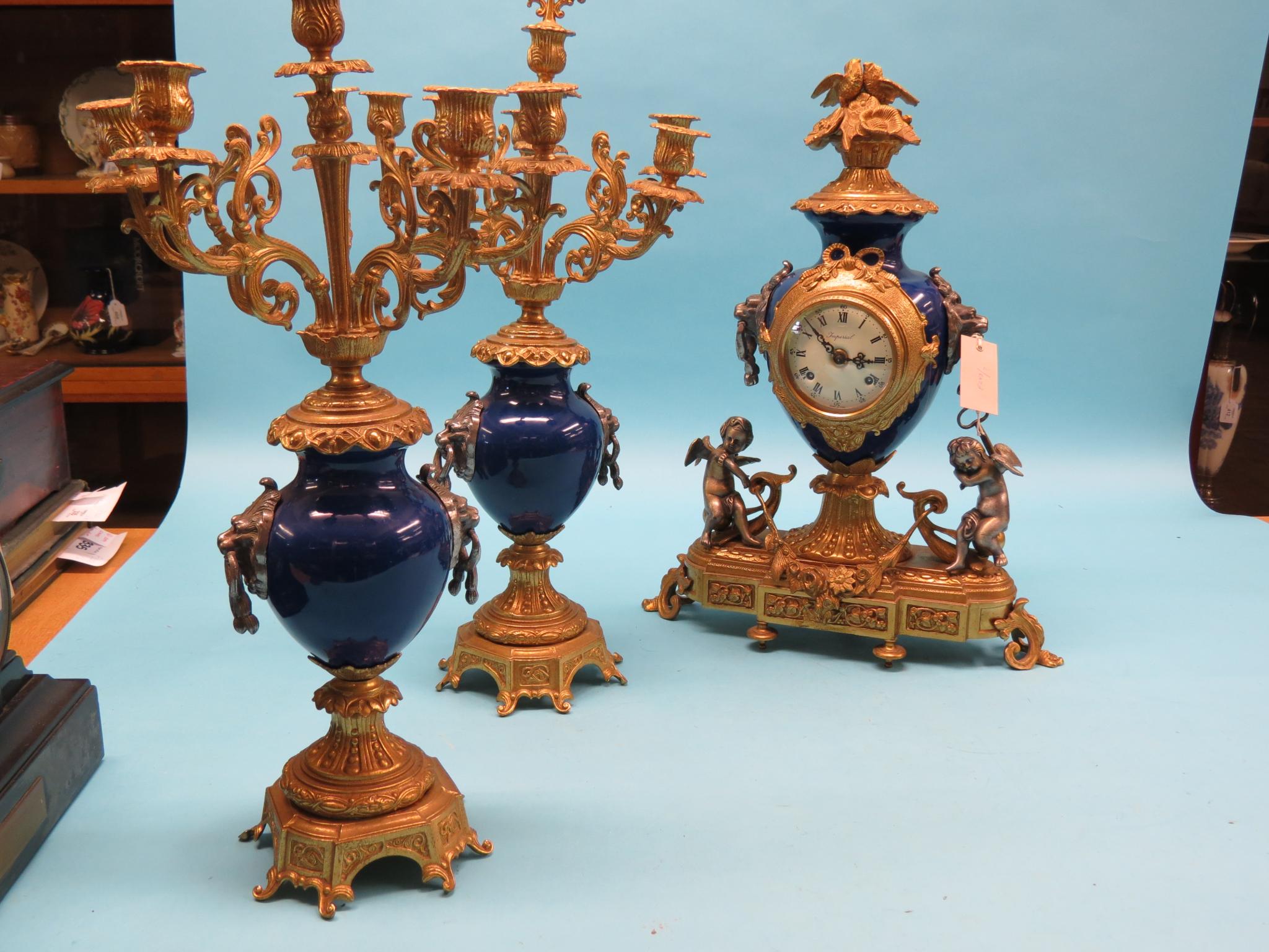 Appraisal: A th century-style ormolu and blue ceramic clock garniture clock