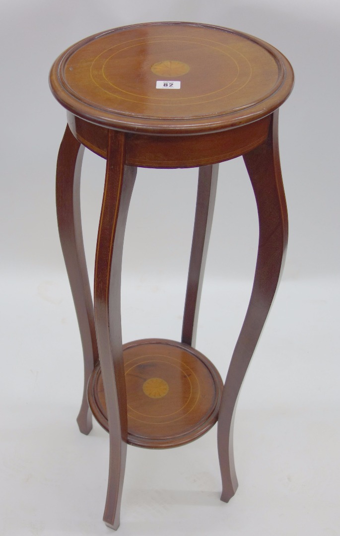 Appraisal: An Edwardian mahogany boxwood strung two tier plant stand cm