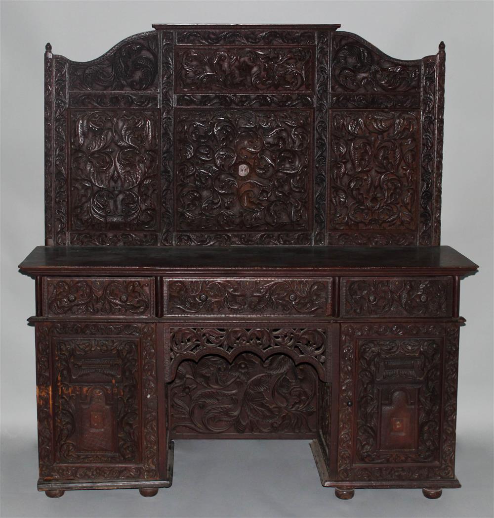 Appraisal: BURMESE CARVED TEAK SIDEBOARD th Century with elaborately carved back