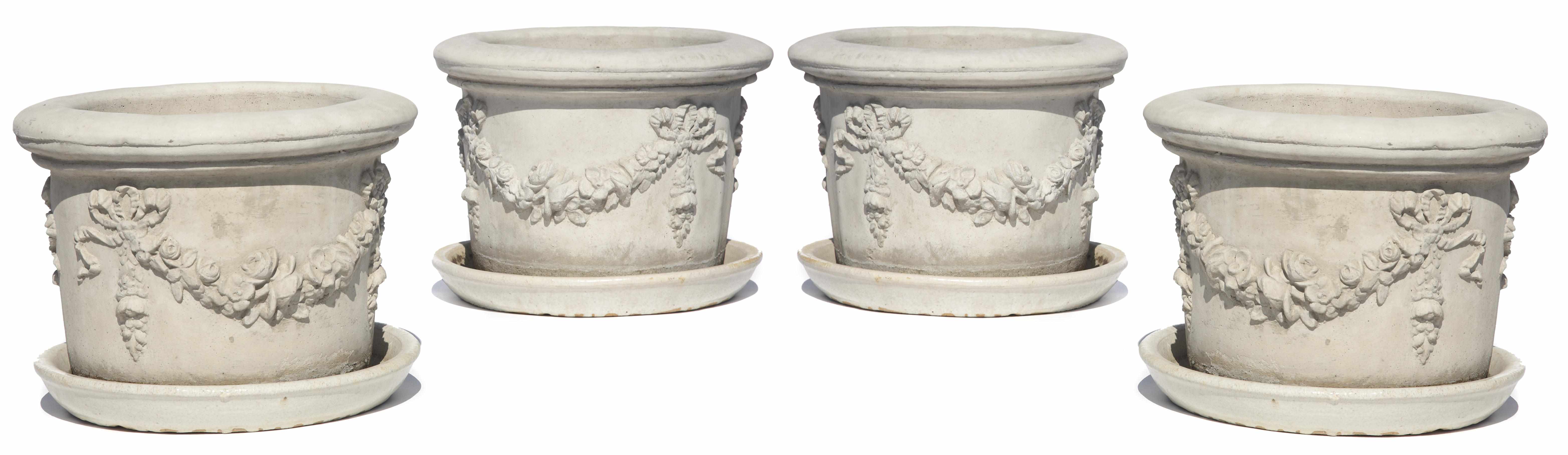 Appraisal: A set of four cast stone jardinires height in cm